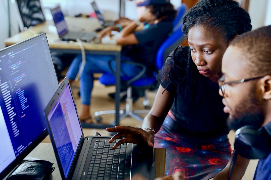 Two engineers pairing on code together