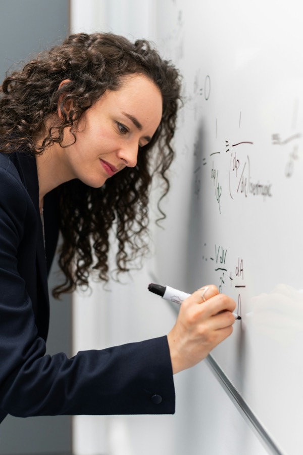 Engineer working through infrastructure design on a whiteboard